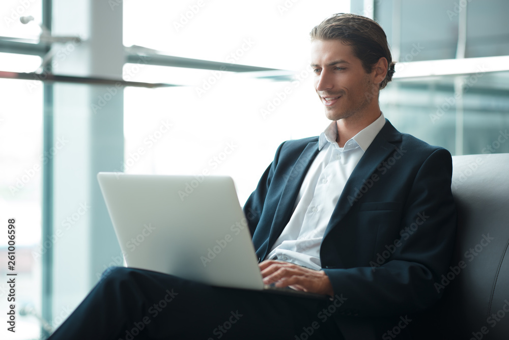 Young handsome businessman conducting negotiations with investors. Electronic business. Alternative payment services. Management of the projects on freelance. Cryptocurrency. Blockchain. Trader. Young handsome businessman conducting negotiations with investors. Electronic business. Alternative payment services. Management of the projects on freelance. Cryptocurrency. Blockchain. Trader.
