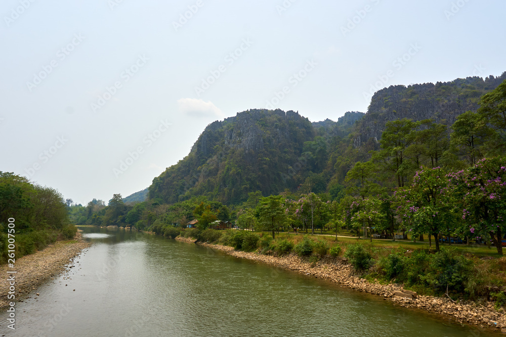 Beautiful landscapes from river in Vang Vieng , Loas mountains in background Beautiful landscapes from river in Vang Vieng , Loas mountains in background