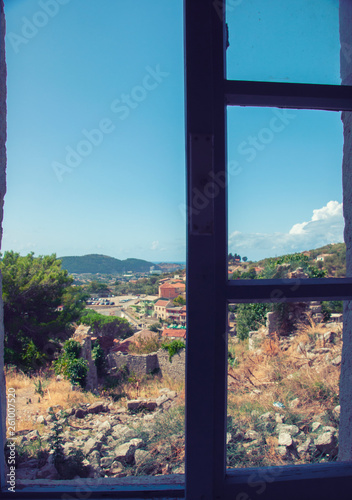 View of the city from the window of the building in the fortress of the old bar, Montenegro. Summer.