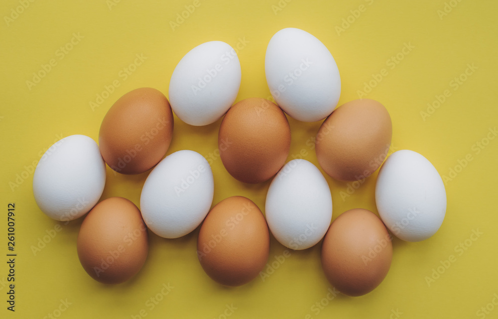 Many eggs on a yellow background.