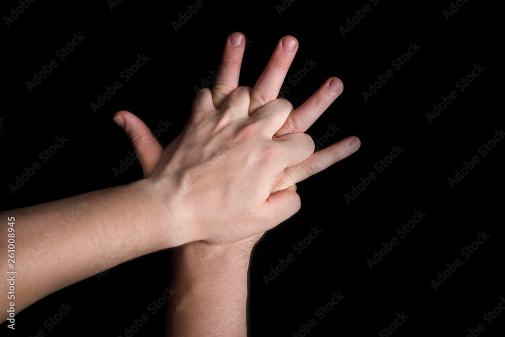 position of hands in an indirect heart massage on a black background