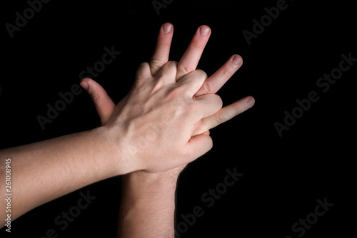 position of hands in an indirect heart massage on a black background
