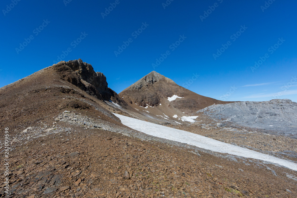 Uri Rotstock mountain peak in Swiss alps, blue sky, summer