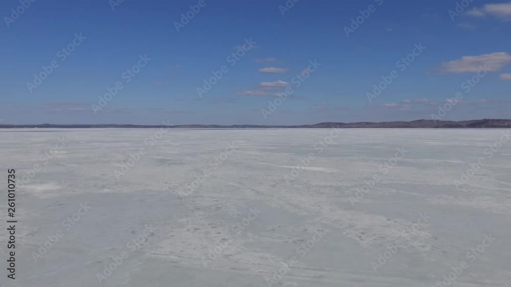 Glowing Shining Snow On A Frozen River On A Sunny Winter Day. Accelerated Slider Dolly Video Shot. Glowing Shining Snow On A Frozen River On A Sunny Winter Day. Accelerated Slider Dolly Video Shot.