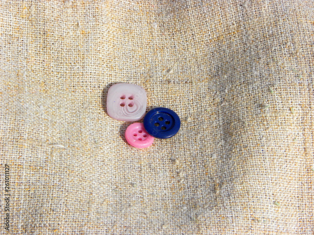 pink and blue buttons on the fabric pink and blue buttons on the fabric