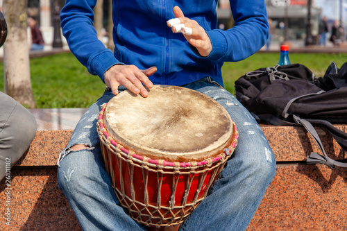 street musician plays bongo