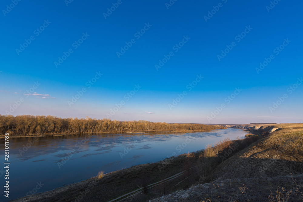 panorama of the river. wide channel, blue sky. mountain shore panorama of the river. wide channel, blue sky. mountain shore