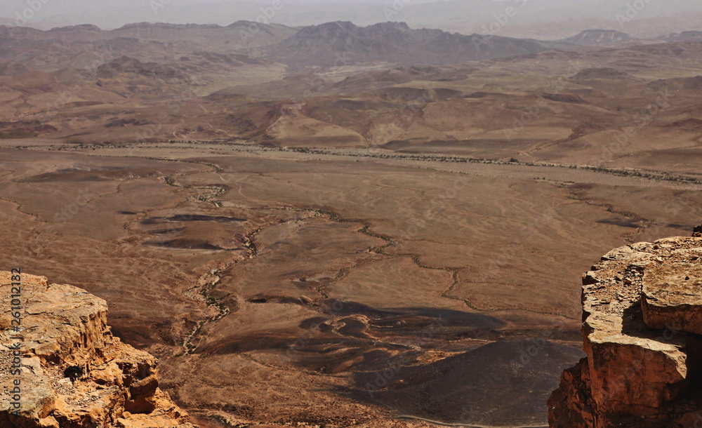 Fototapeta premium Machtesh Ramon - erosion crater in the Negev desert, the most picturesque natural landmark of Israel..&nbsp; Unearthly landscapes, geological phenomena, absolute silence.