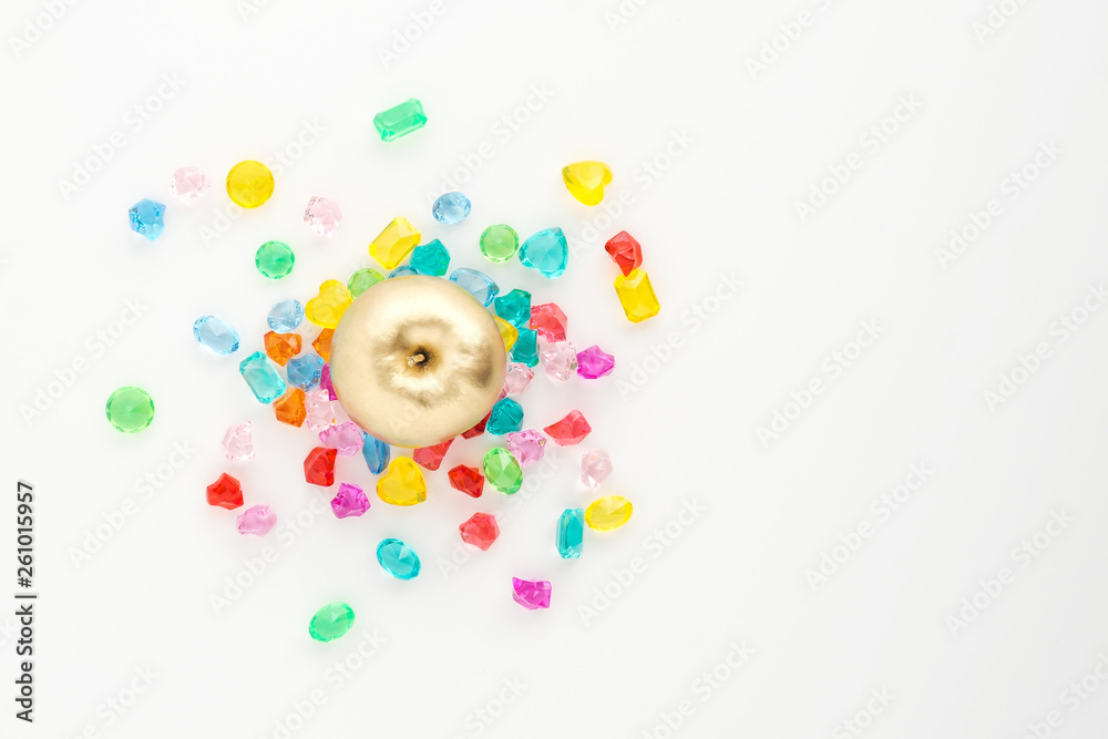A scattering of many small different gems on a white background. Multicolor. Concept of explosion, burst, congratulations card. A scattering of many small different gems on a white background. Multicolor. Concept of explosion, burst, congratulations card.