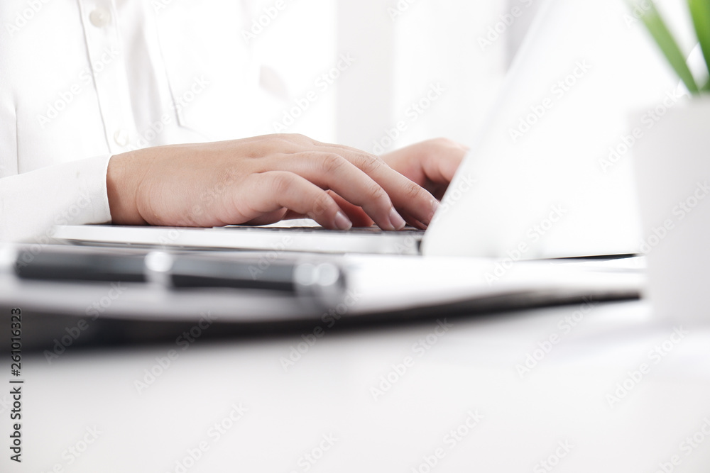 young female professional working in bright office . young female professional working in bright office .