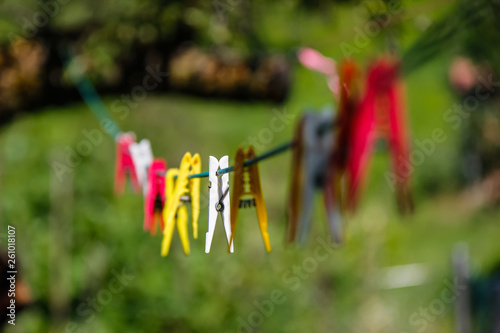 colorful clothes pegs on line