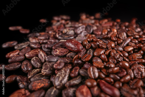 Cocoa beans isolated on black background. Roasted beans. 