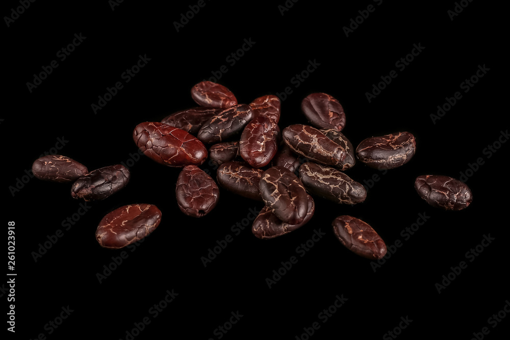 Roasted beans. Cocoa beans and coffee beans isolated on black background. Roasted beans. Cocoa beans and coffee beans isolated on black background.