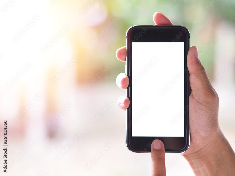 The woman's hand is holding the phone in his hand. The phone has a white screen.
