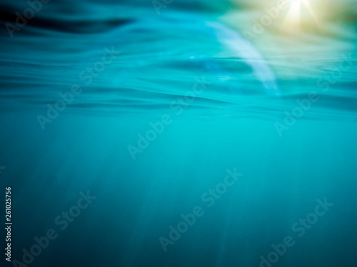 underwater background with sunbeams