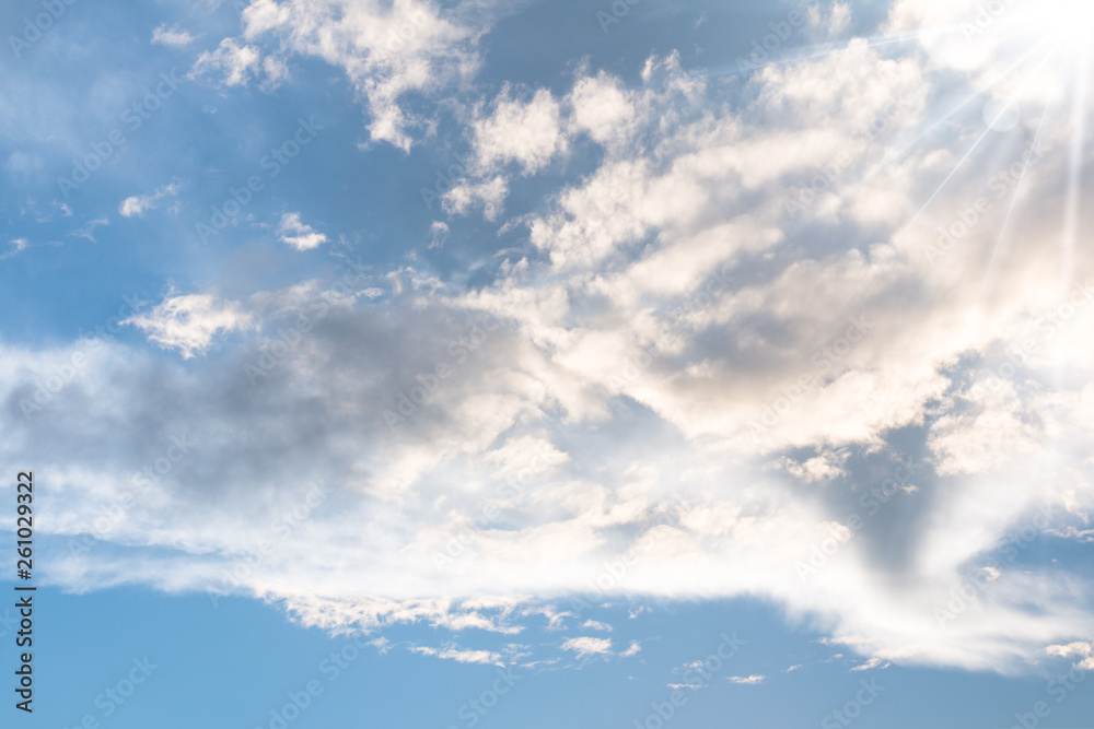 Obraz premium Blue sky with clouds background with sun rays