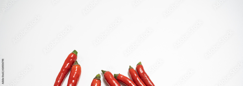 Red chilli isolated in white background with an egg spelling the letter of love Red chilli isolated in white background with an egg spelling the letter of love