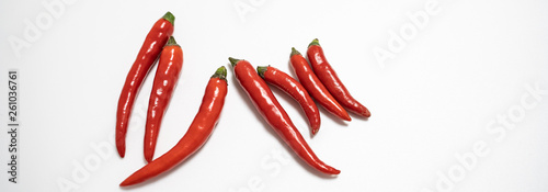 Red chilli isolated in white background with an egg spelling the letter of love