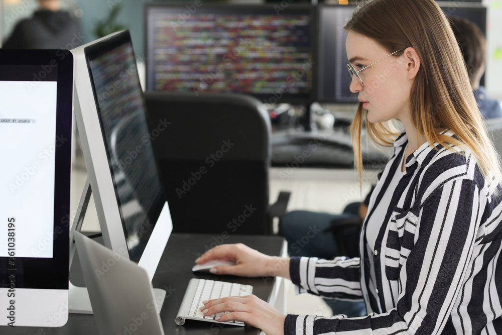 Female programmer working in office Female programmer working in office