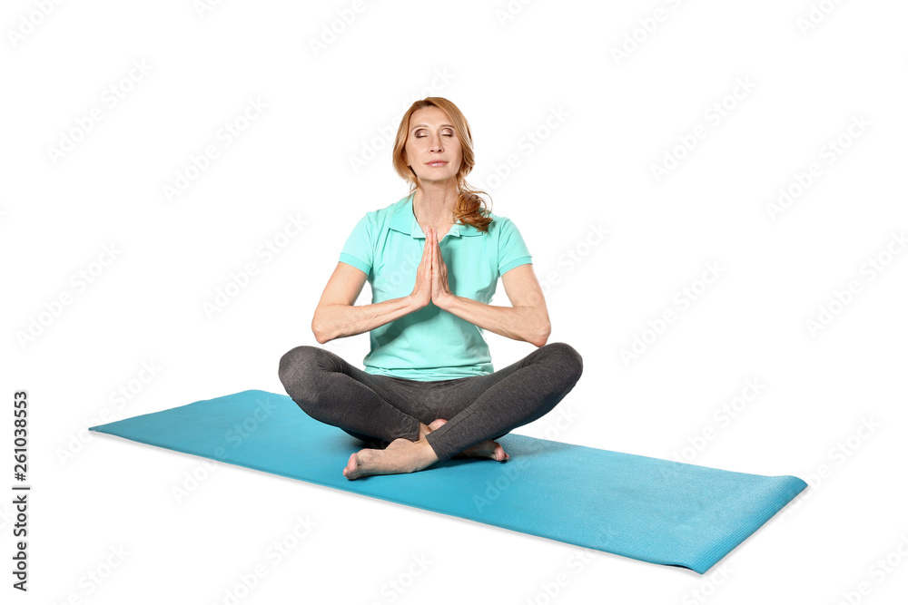 Mature woman practicing yoga on white background Mature woman practicing yoga on white background