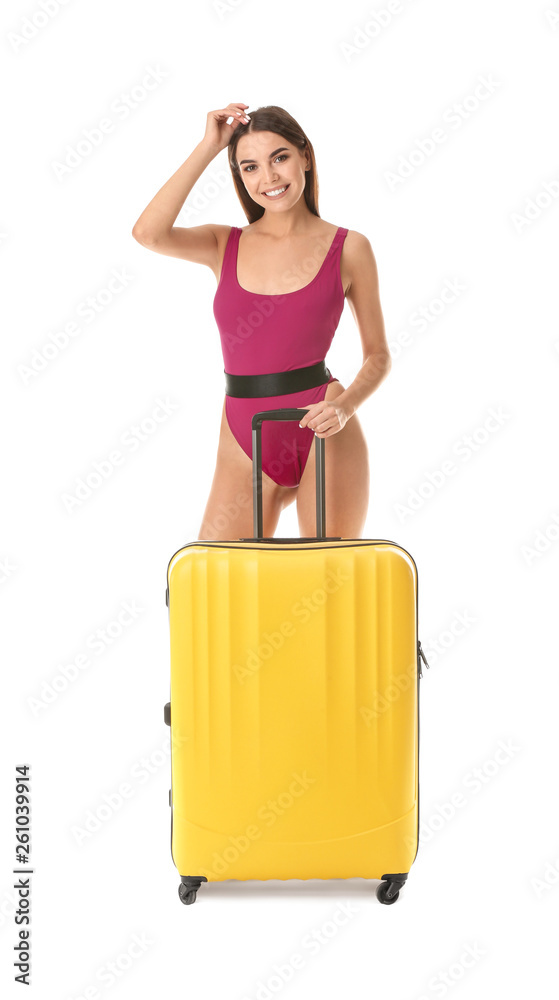 Beautiful young woman in swimming suit and with suitcase on white background Beautiful young woman in swimming suit and with suitcase on white background
