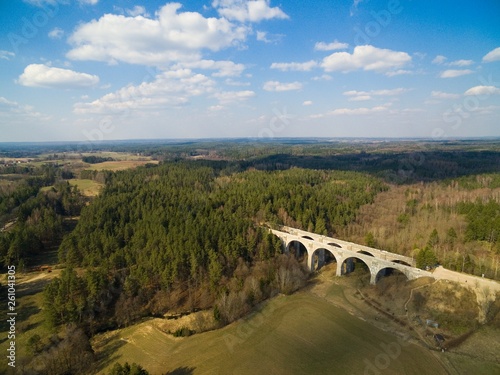 Aerial view of old concrete railway bridges in Stanczyki during spring season, Mazury, Poland