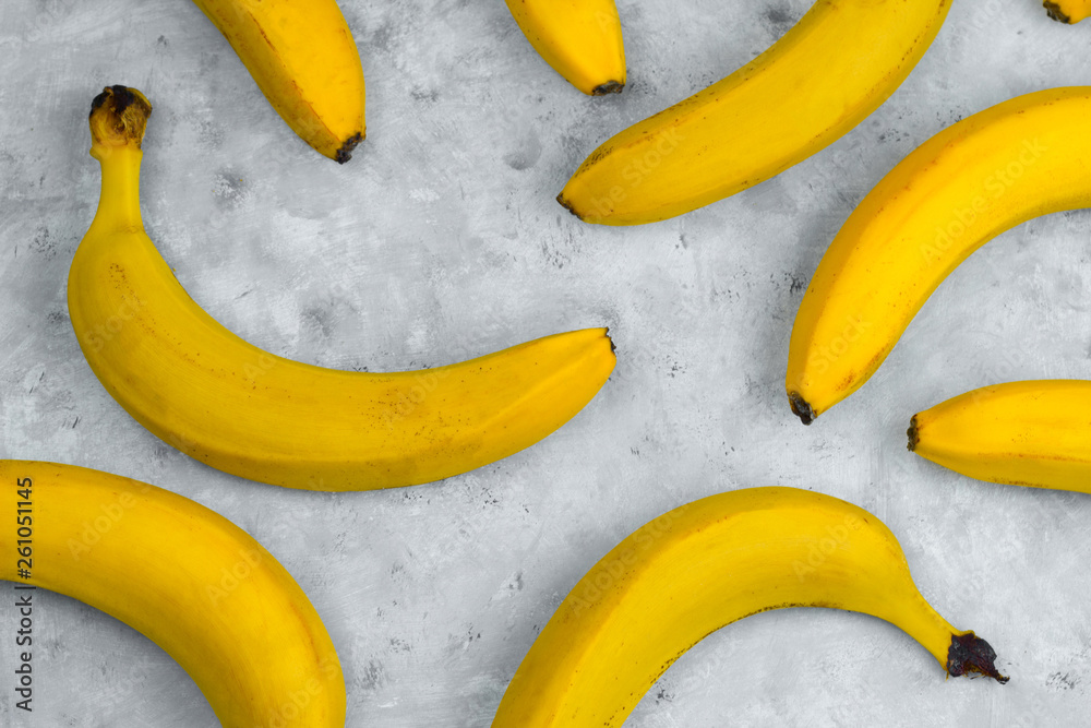 pattern of fresh yellow bananas on gray background