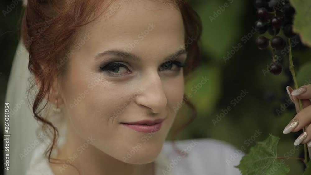 Beautiful and lovely bride in night gown and veil in the garden. Wedding morning Beautiful and lovely bride in night gown and veil in the garden. Wedding morning