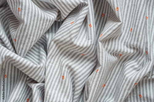 Striped Cotton Shirt Background. Crumpled Fabric Texture as Blank Background