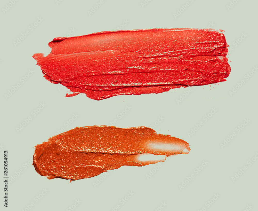 Red purple orange lipstick light gray background texture smudged Red purple orange lipstick light gray background texture smudged