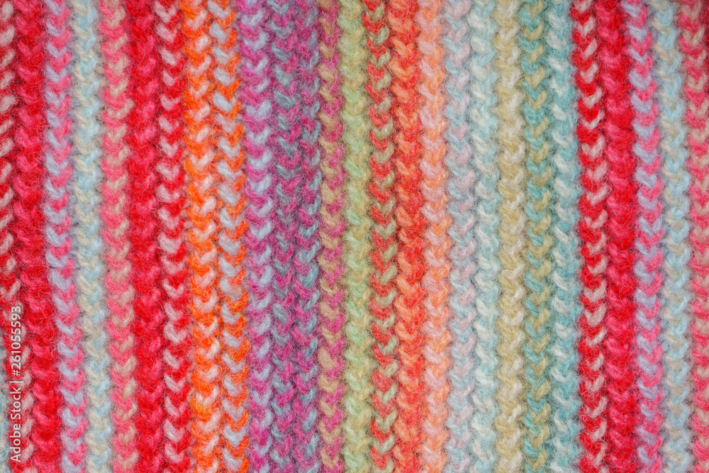 Multicolored Knitwear Sweater Fabric Texture. Bright saturated background Multicolored Knitwear Sweater Fabric Texture. Bright saturated background