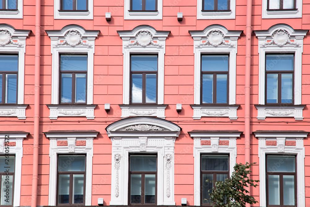 windows and details on an exterior of the building. windows and details on an exterior of the building.