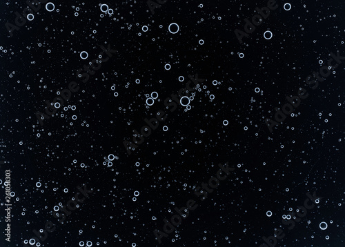 Cream gel blue transparent cosmetic sample texture with bubbles isolated on black background