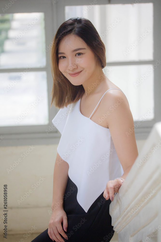 Portrait of thai adult beautiful girl relax and smile Portrait of thai adult beautiful girl relax and smile