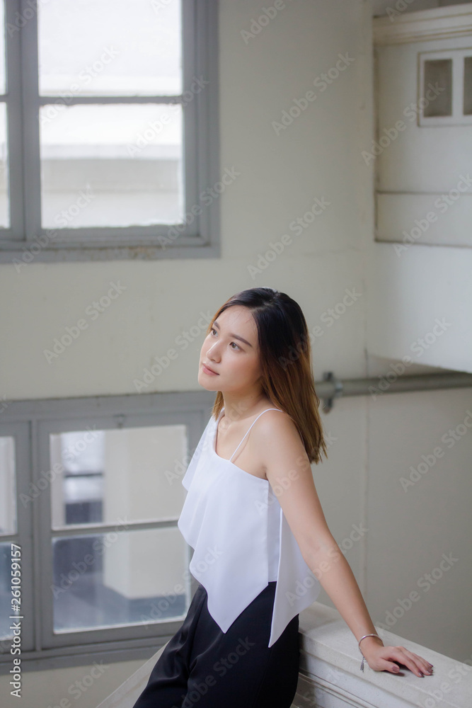 Portrait of thai adult beautiful girl relax and smile Portrait of thai adult beautiful girl relax and smile