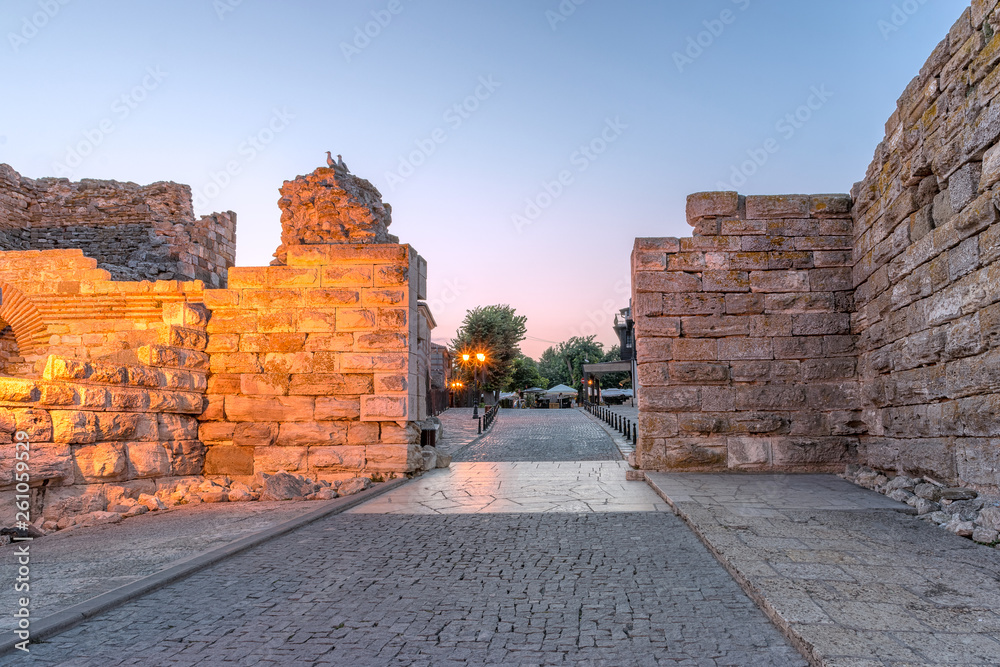 Entrance gates in the Nessebar ancient city at sunrise on the Bulgarian Black Sea Coast. Nesebar, Nesebr is a UNESCO World Heritage Site. Ruins at sunrise in Nessebar, Bulgaria
