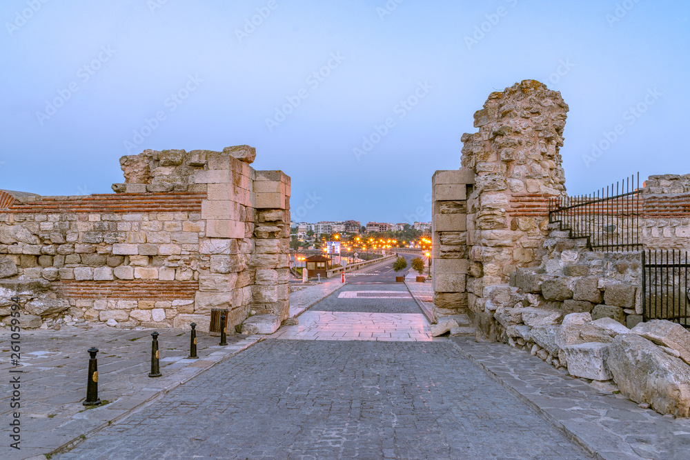Entrance gates in the Nessebar ancient city at sunrise on the Bulgarian Black Sea Coast. Nesebar, Nesebr is a UNESCO World Heritage Site. Ruins at sunrise in Nessebar, Bulgaria
