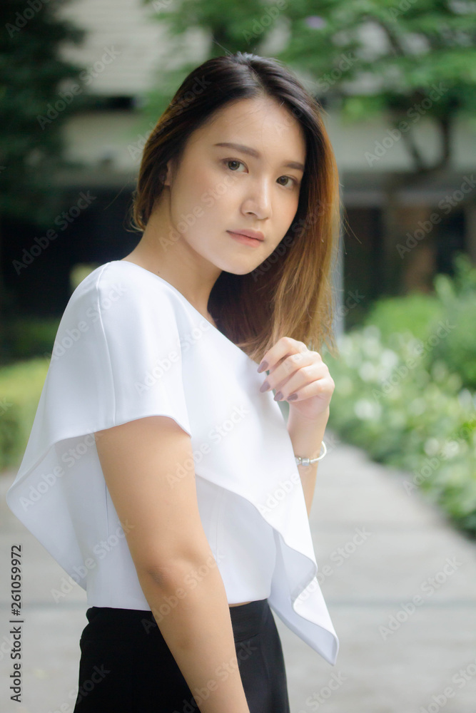 Portrait of thai adult beautiful girl relax and smile Portrait of thai adult beautiful girl relax and smile