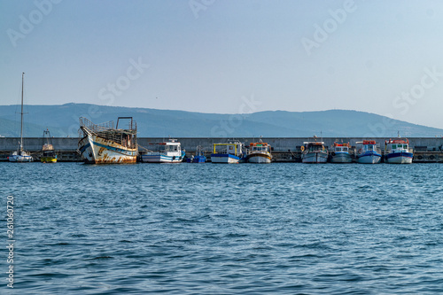 Fishing Boats docked at a harbor port in Nessebar ancient city  one of the major seaside resorts on the Bulgarian Black Sea Coast. Nesebar or Nesebr is a UNESCO World Heritage Site. Boats in Nessebar