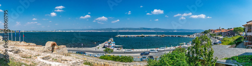 Panorama of Nessebar ancient city ruins and the harbor port. Nesebar, Nesebr is a UNESCO World Heritage Site. Panoramic view of Nessebar Ancient City harbor and ruins on a sunny day with blue sky