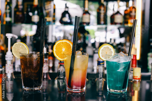 three cocktails at the bar