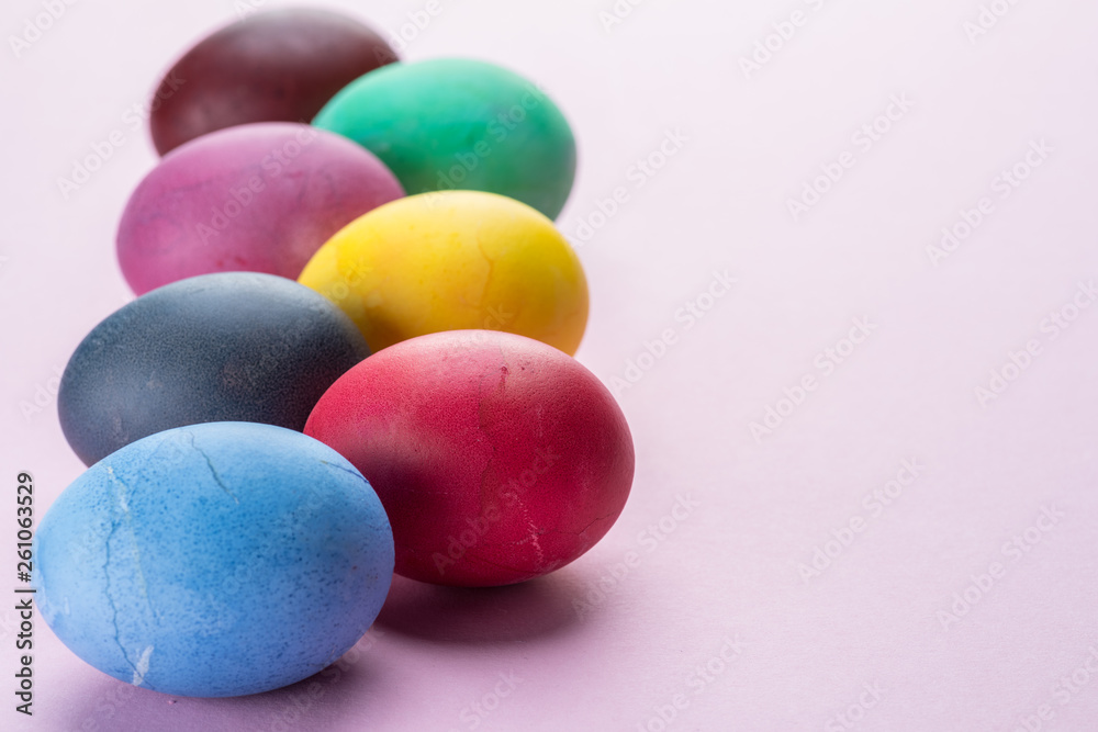 Colorful Easter eggs as an attribute of Easter celebration. Pink background. Colorful Easter eggs as an attribute of Easter celebration. Pink background.