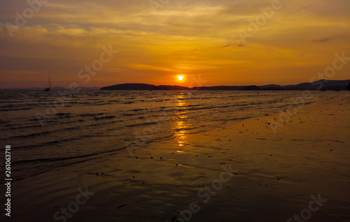 Fototapeta Naklejka Na Ścianę i Meble -  sunset at the beach. The beauty of a tropical beach Thailand sunrise at the beach. beach sand  Ao Nang, Krabi, Thailand