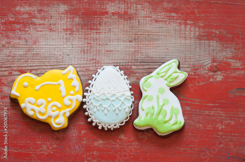 Photography Colorful easter cookies on wooden background