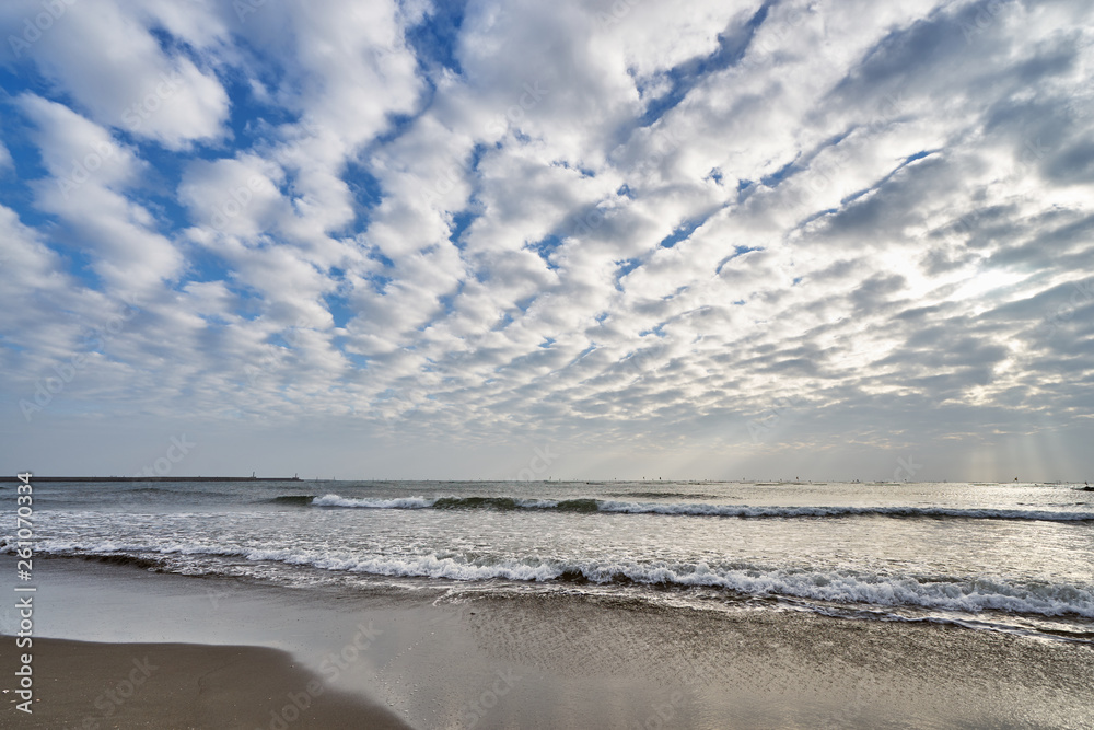 Beautiful scenics of Qiaotou Beach with flowing clouds and waves from the south china sea at Qiaotouhaitan park in Tainan, Taiwan.