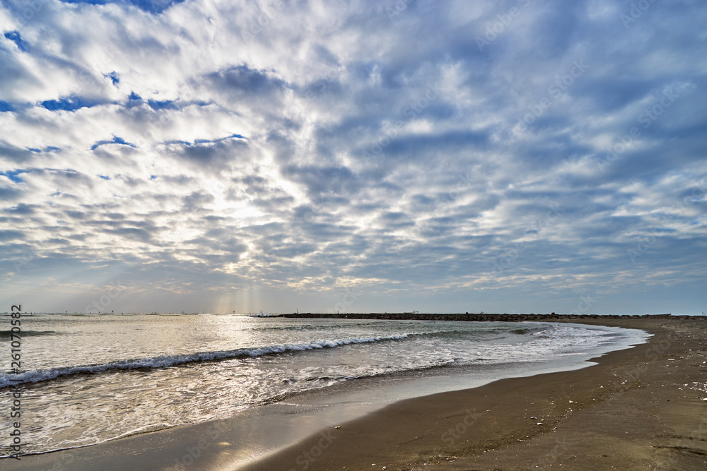 Beautiful scenics of Qiaotou Beach with flowing clouds and waves from the south china sea at Qiaotouhaitan park in Tainan, Taiwan.