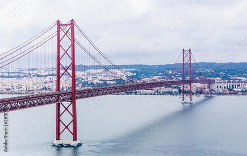 Ponte 25 de Abril Bridge in Lisbon, Portugal. Connects the cities of Lisbon and Almada crossing the Tagus River. View from Almada with Lisbon across