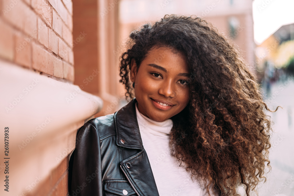 Headshot of beautiful mixed-race girl with curly hair. Stock Photo | Adobe  Stock
