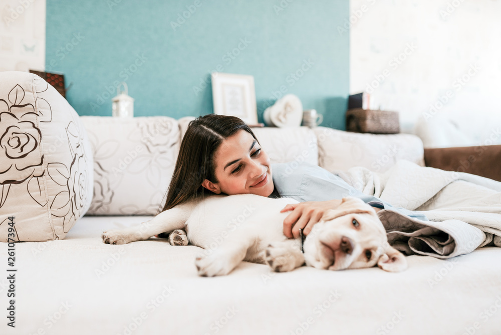 Lying in bed with a dog. Lying in bed with a dog.