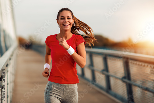Fototapeta Naklejka Na Ścianę i Meble -  Young  woman jogging outdoors